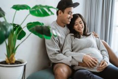 happiness couples holding the wife's pregnant stomach